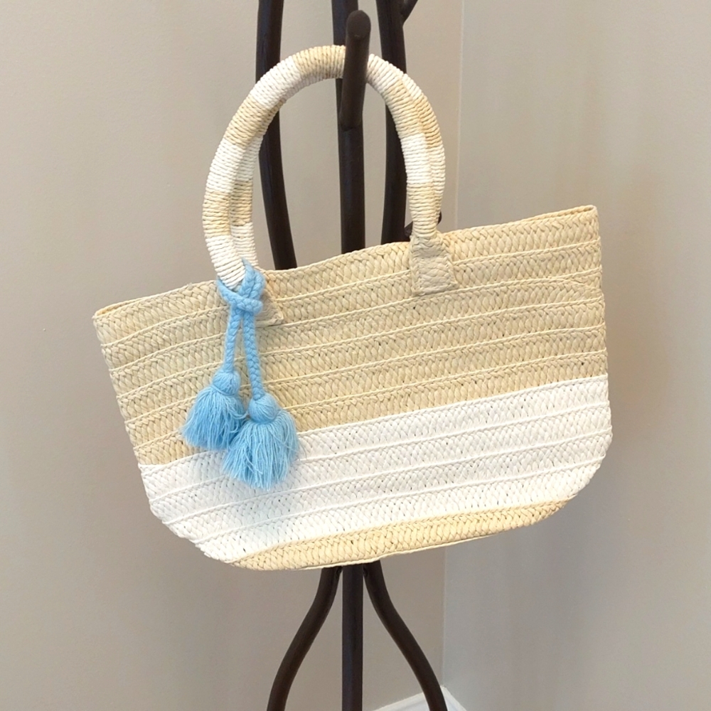 Altru straw tote with detachable blue tassel